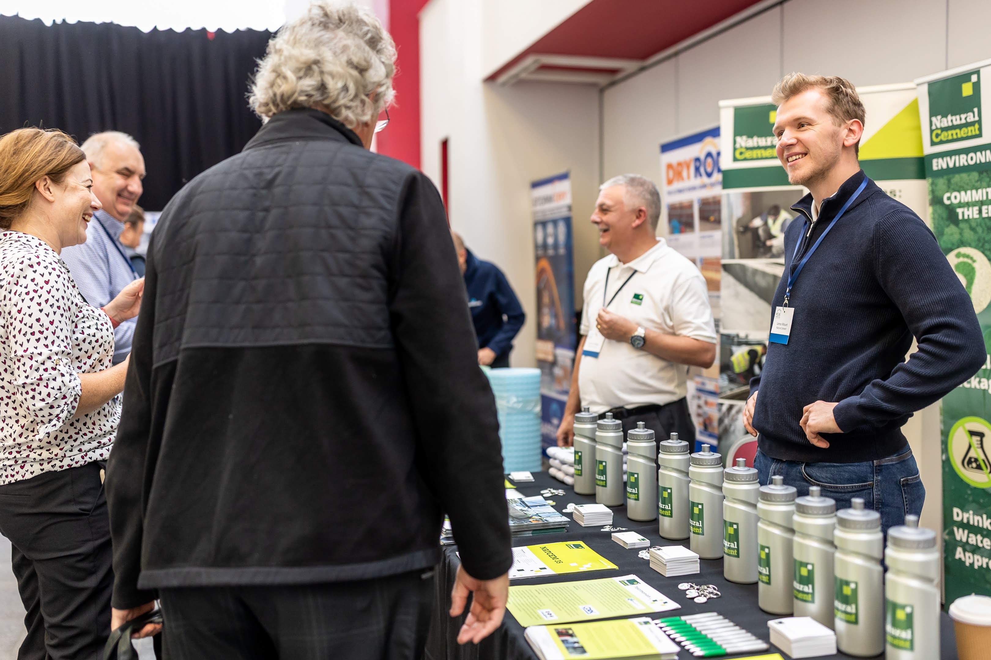 James Mount engaging attendees at a Natural Cement exhibition stand